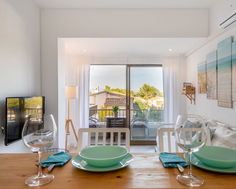 a dining table with a table setting for two