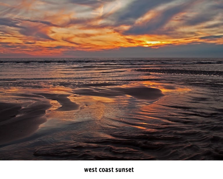 sunset over blackpool beach with sand contours in the foreground