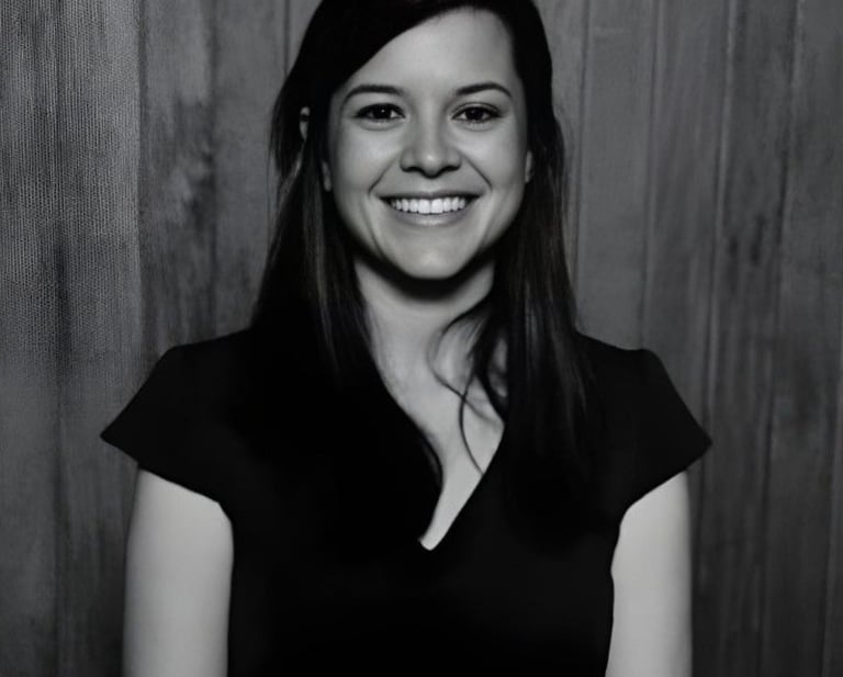 Professional psychologist smiling for a photo in formal wear