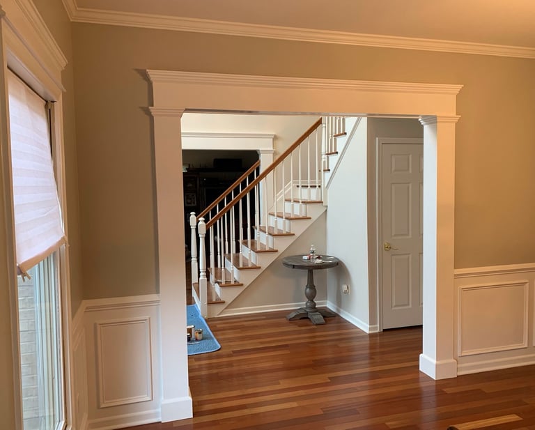 Custom crown molding, doorway casing, and wainscoting in a Monmouth County NJ home