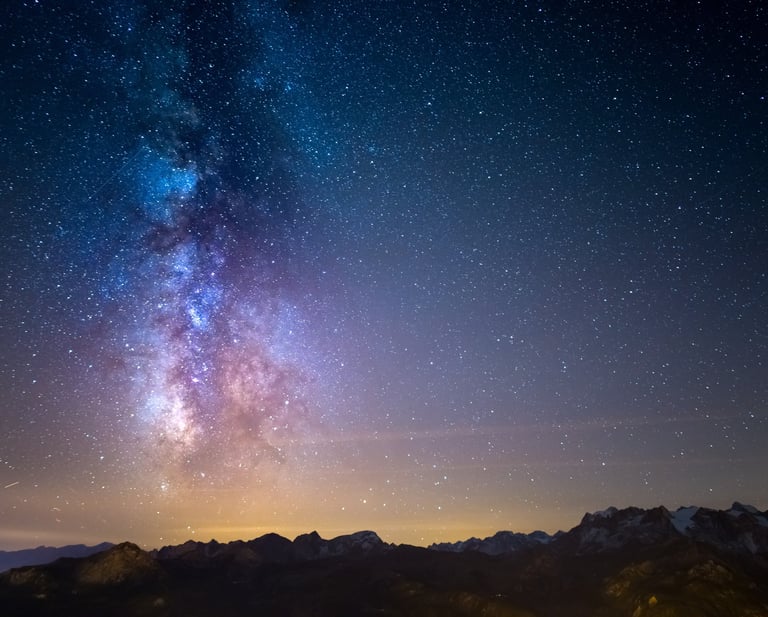 Milky Way galaxy over snowy mountains