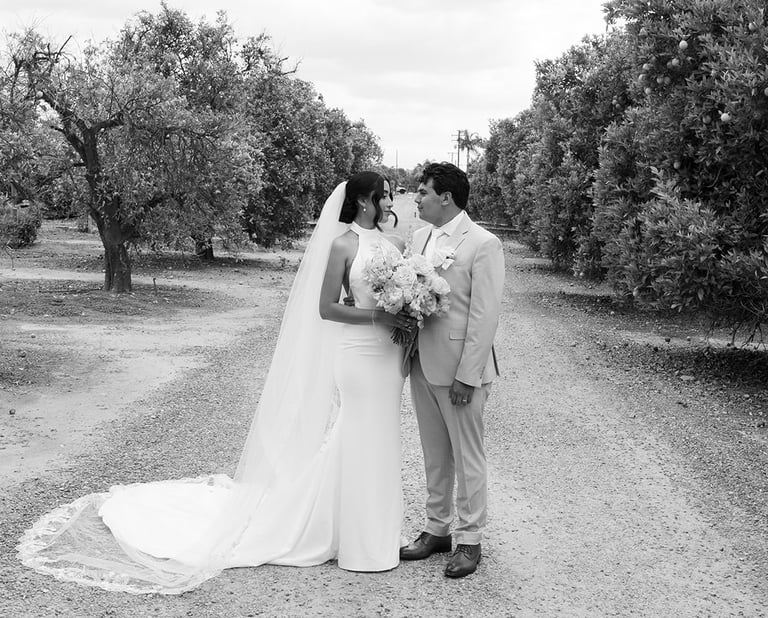 a bride and groom kissing at The Grove Redlands