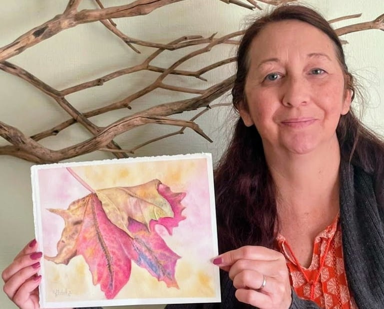 Artist holding Maple leaf finished painting