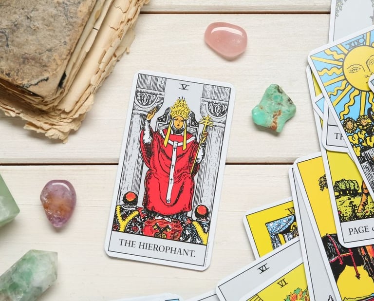 The Hierophant tarot card on a stack with crystals for tarot study for beginners