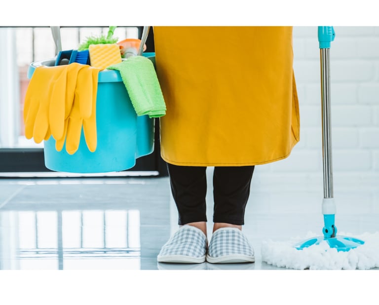 a woman in a yellow dress holding a mop and cleaning supplies