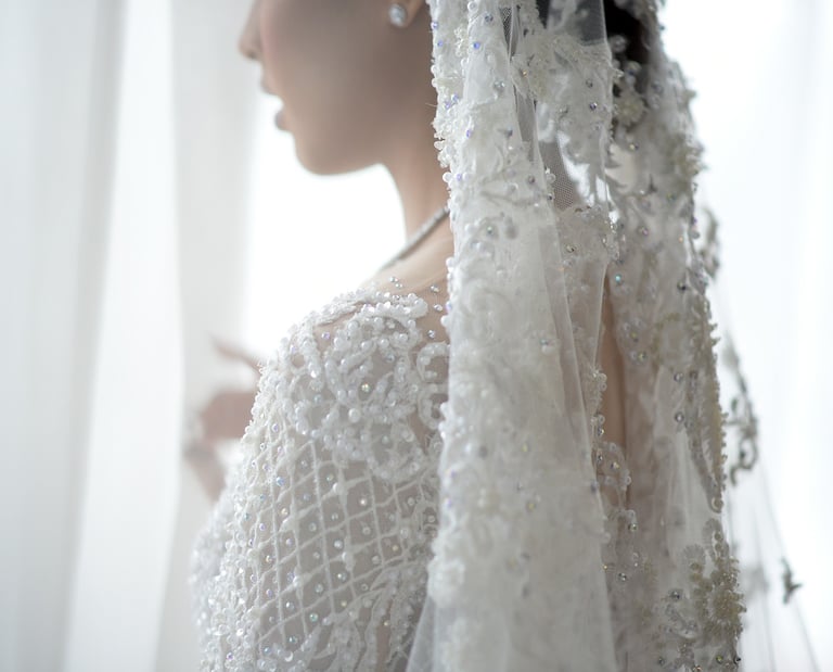 wedding photographer, a woman in a wedding dress with a veil