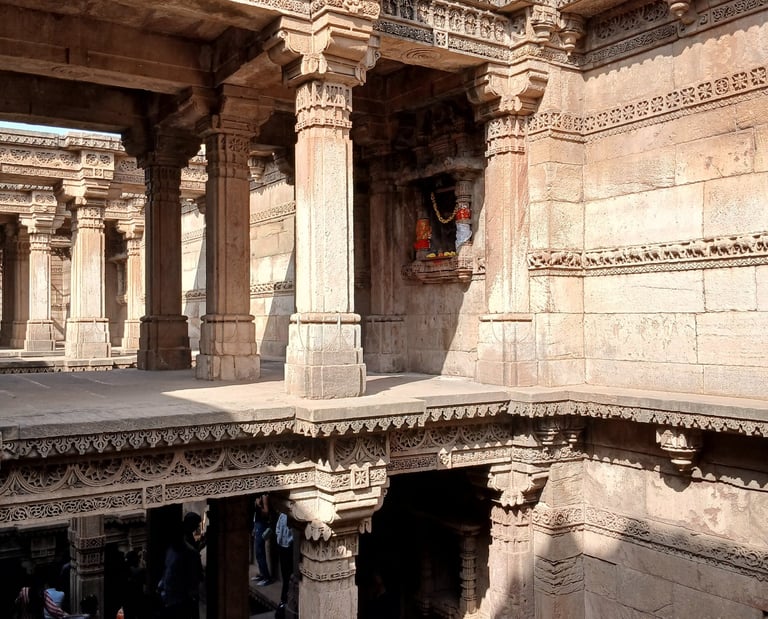 Ornate stone pillars and galleries of Adalaj Stepwell, Gujarat