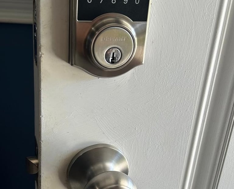 residential locksmith rekeying a door lock at a home in Volusia County