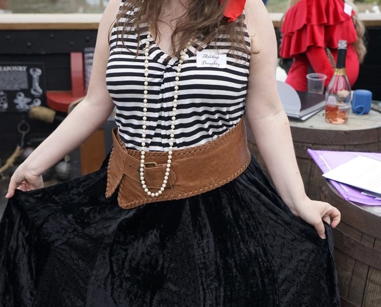 girl dressed as a pirate at themed party