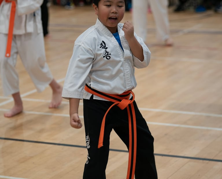 A 8 year old practising his martial arts blocks in our Horley martial arts classes.