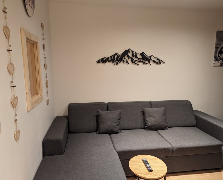 Cozy lounge area inside a modern mountain apartment in Val Thorens with warm alpine atmosphere