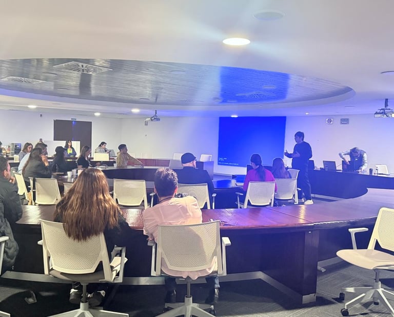 Professional workshop and seminar presentation in a modern conference room with attendees.