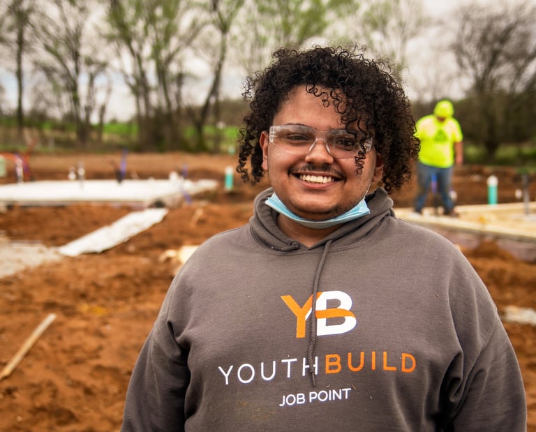 Headshot of Christopher Nichols sporting a Job Point sweatshirt