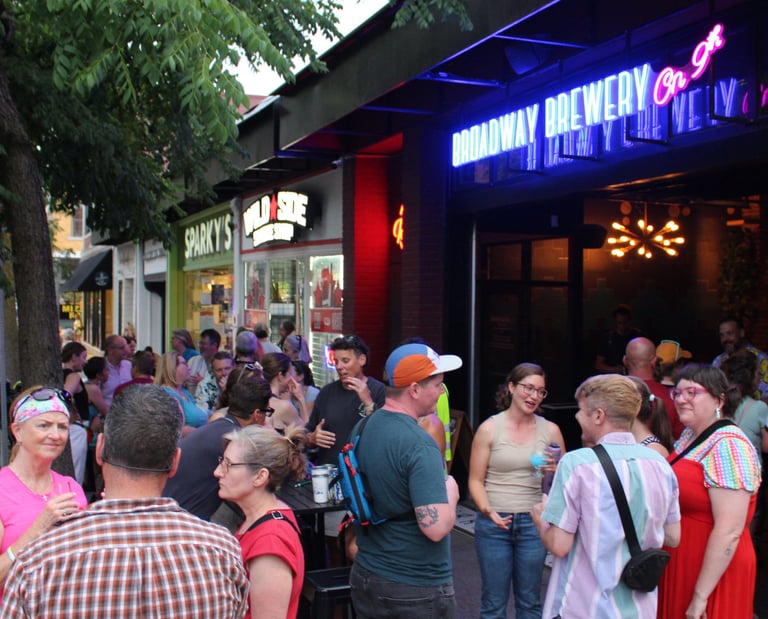 Large group gathered in front of Broadway Brewery