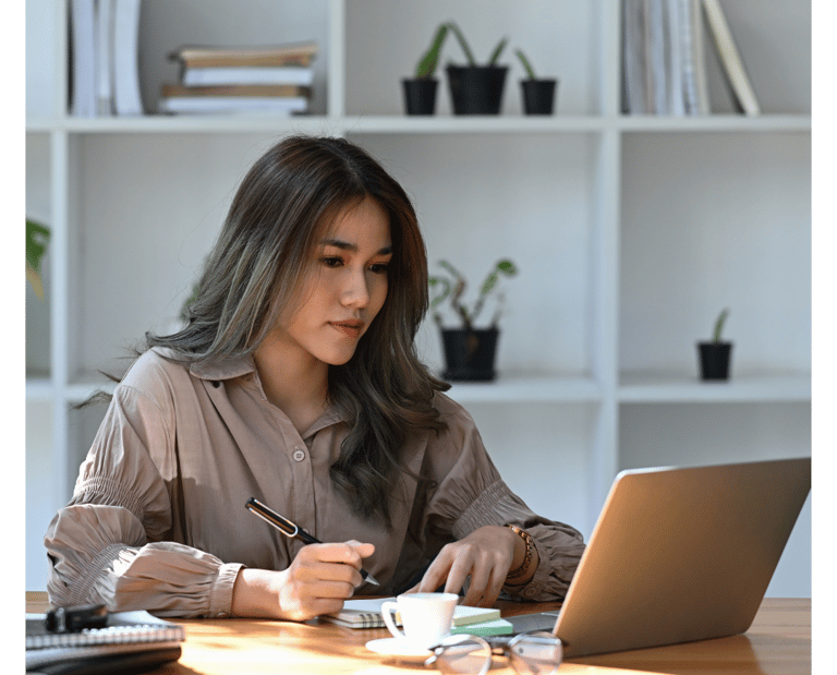 a computer user sitting at a desk learning new cybersecurity skills with Lümee awareness platform
