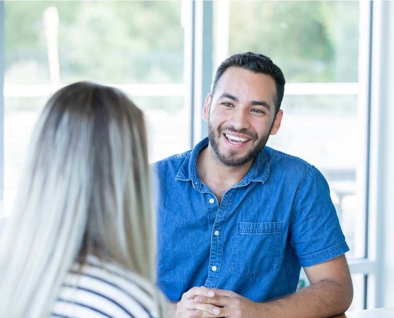 a man and woman sitting at a table