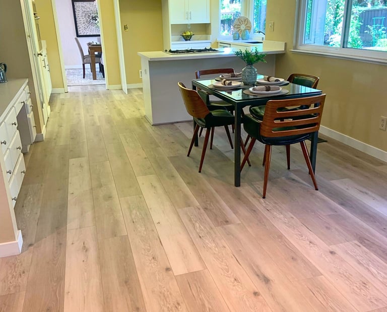 a dining room with a table and chairs