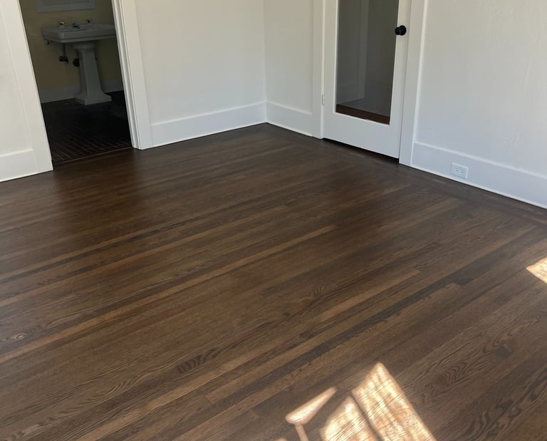 a room with a wooden floor and a door