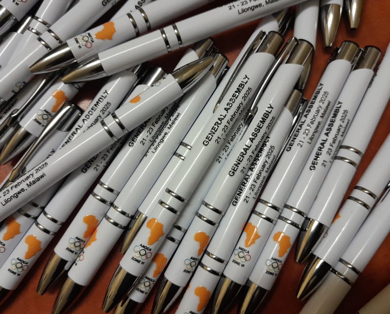 a bunch of pens and pens on a table