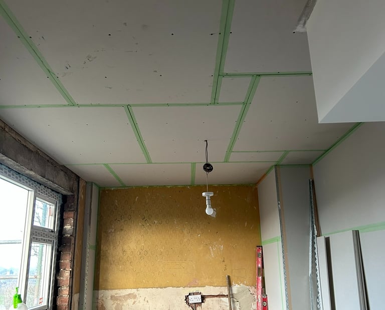 New higher window, fireplace removed, new electrics. Ready to Plaster!