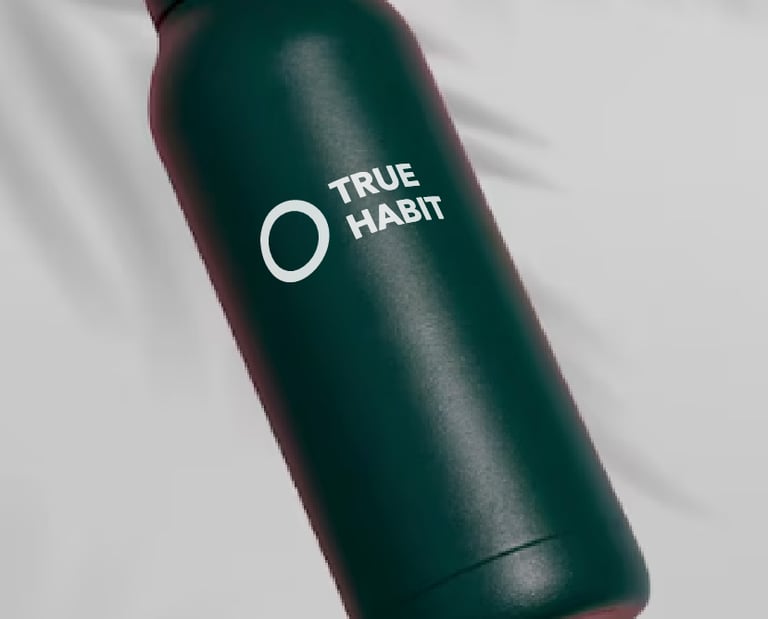 a bottle of Truehabit in a green bottle
