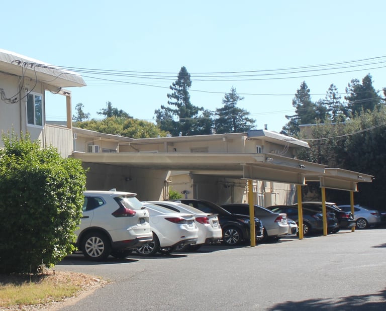 cars in off street parking lot at university commons apartments