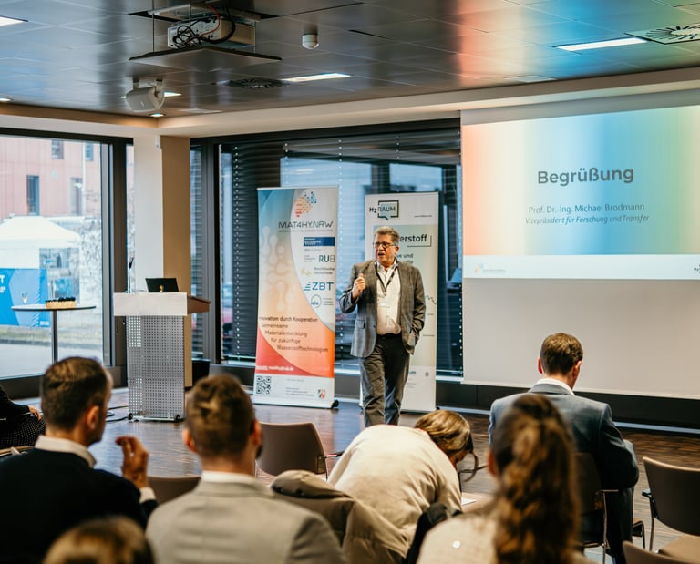 Professor Michael Brodmann giving a keynote presentation at a hydrogen technology research seminar.