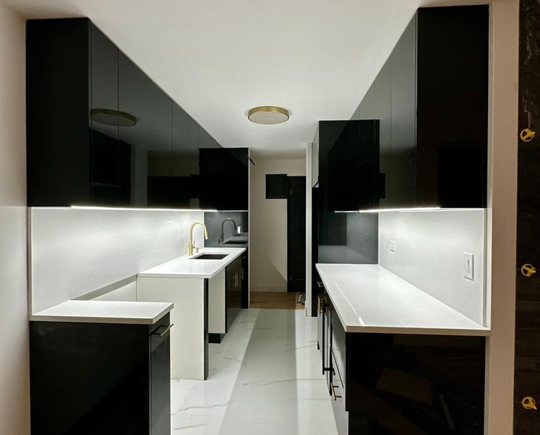 a kitchen with a long counter top and a sink