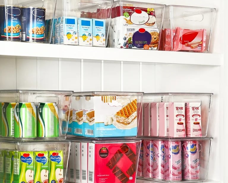 an organized pantry with a variety of different types of food in bins