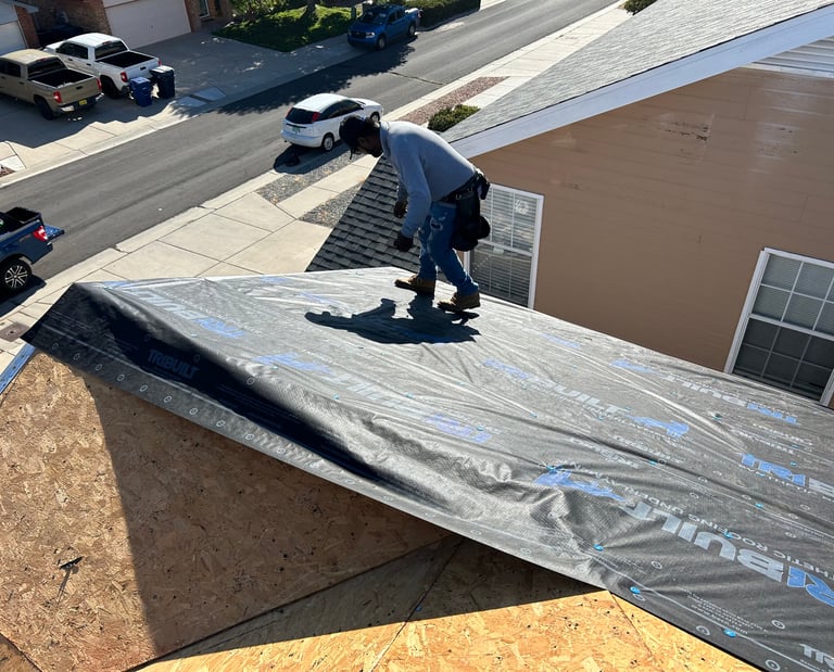 a man installing a residential roof
