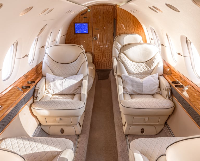 Hawker 800XP cabin interior with luxury leather seating and ambient lighting