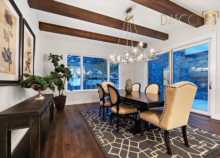 a dining room with a table and chairs