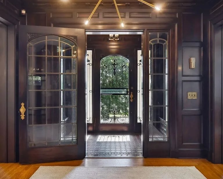 a large foyer with a chandelier and a chandelier