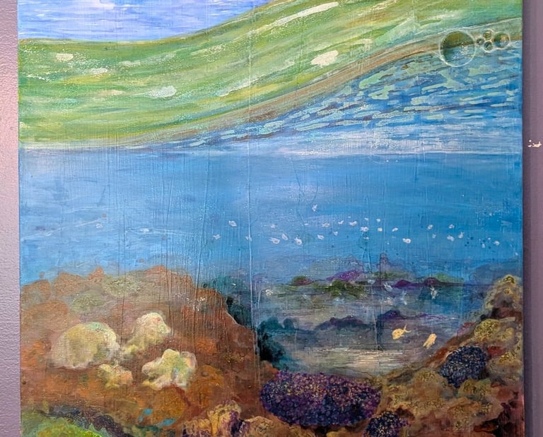 A color rich acrylic painting of coral reef life under a cloudy bright sky and saltwater waves by Kathy LaFollett.