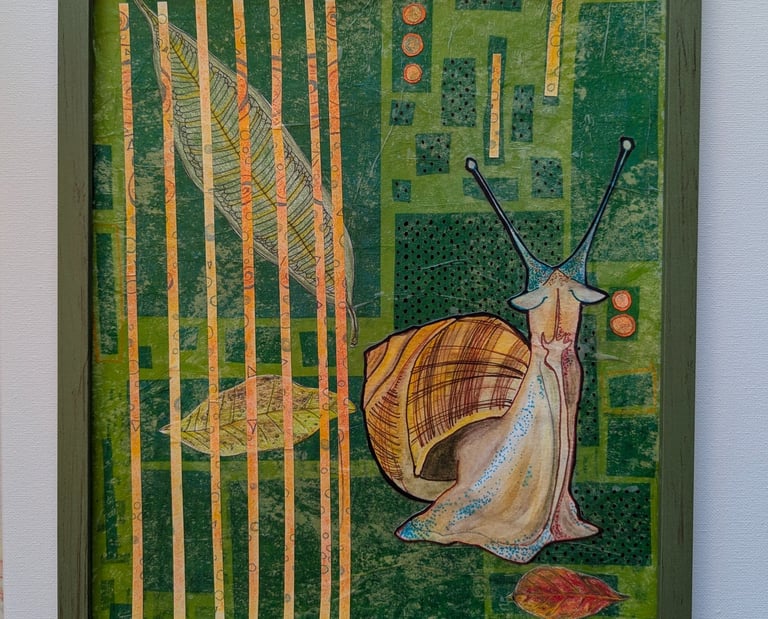 Green and orange playful mid-mod art of a helix snail in a green frame by Kathy LaFollett.
