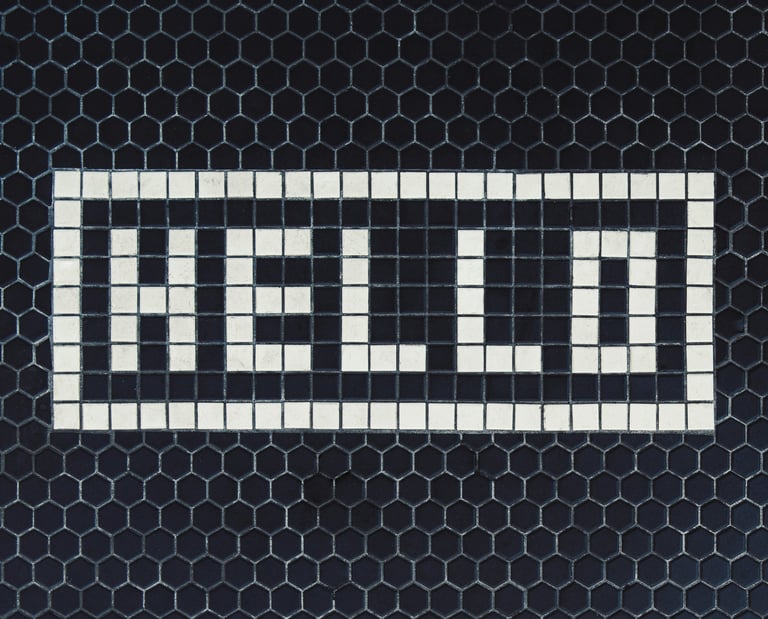 a black and white tile with a white and black checkered pattern