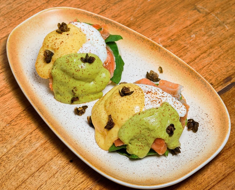 a plate of salmon egg benedict