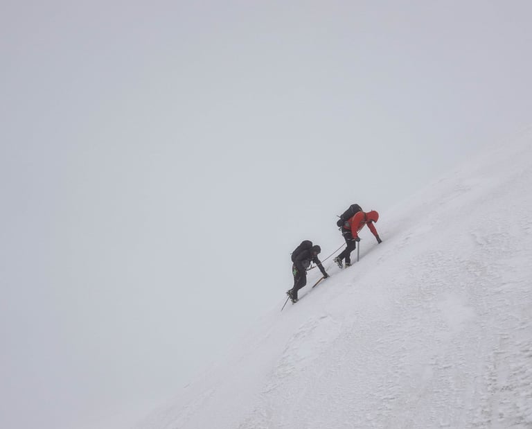 two climbers in the snow, mountain guide and coach, mist, ice