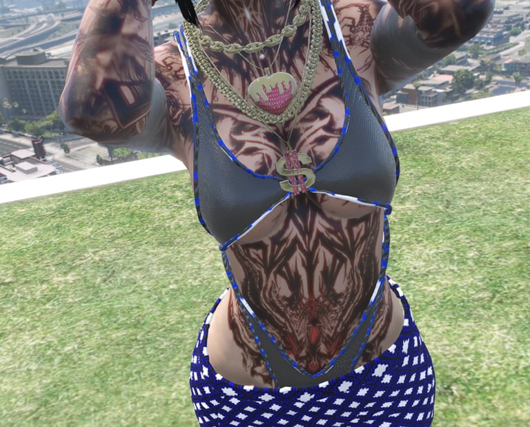 a woman with tattoos on her chest