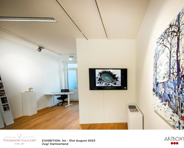 Digital screen with image of digitally manipulated sunflower on it in an art gallery. 
