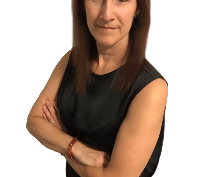 Michelle Mulligan, Mortgage Agent Level 2 at MortgageWell, leaning forward with arms crossed