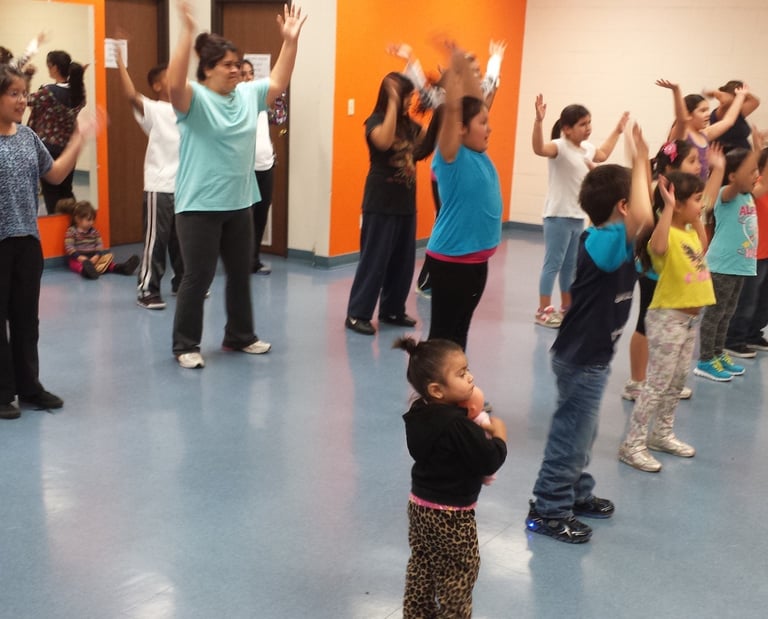 Enhancing Forward Action image of a group of children excising.