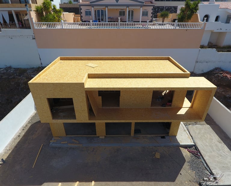 a house with a roof that is being built into a house