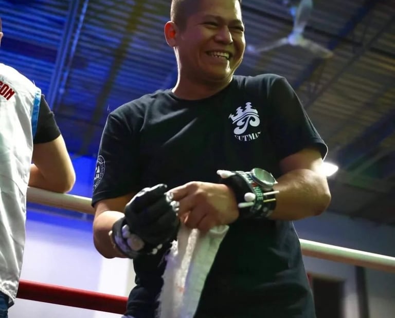 boxing coach philip smiling from the ring