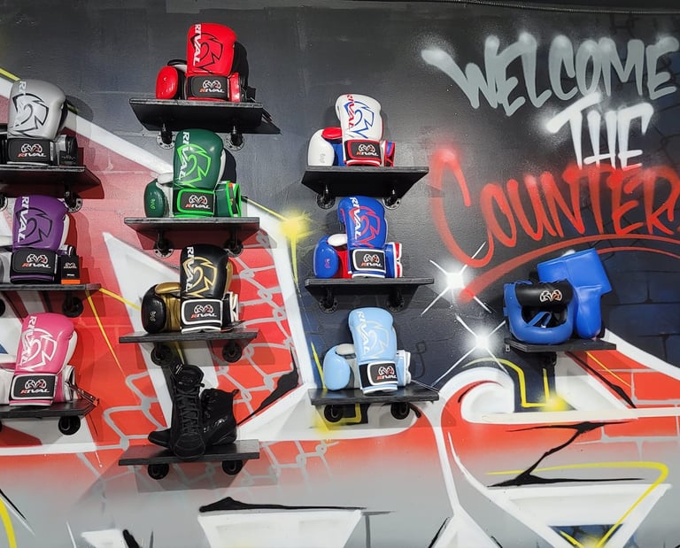 the counterpunch boxing club wall with welcome graffiti and boxing gear mounted to the wall