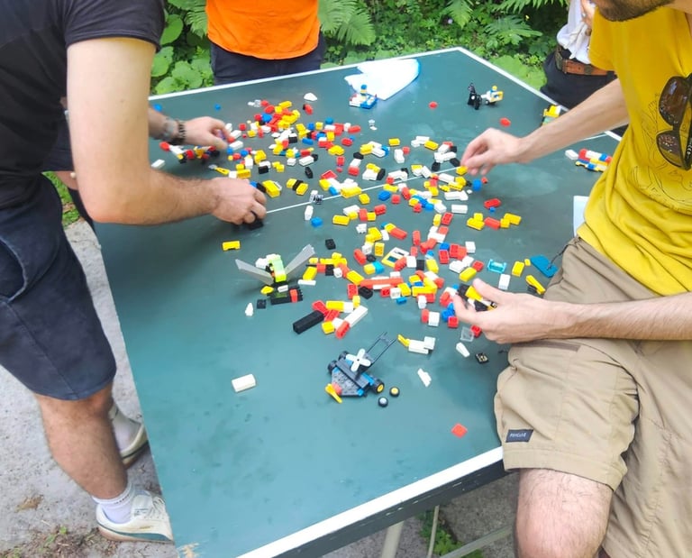 a man and a woman playing a game of legos