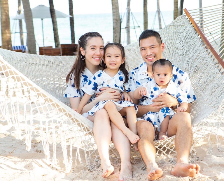 Family photoshoot on beach hammock in Phu Quoc