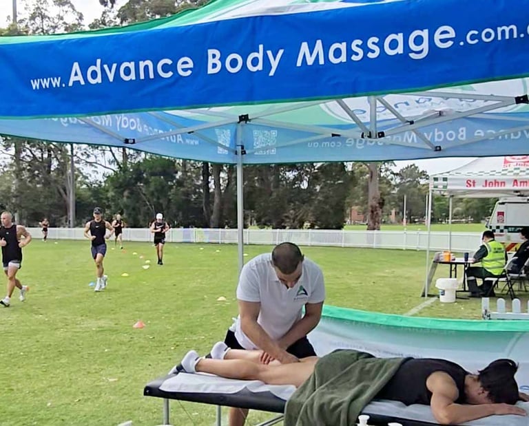 female having a leg sports massage at Wollongong HYROX event