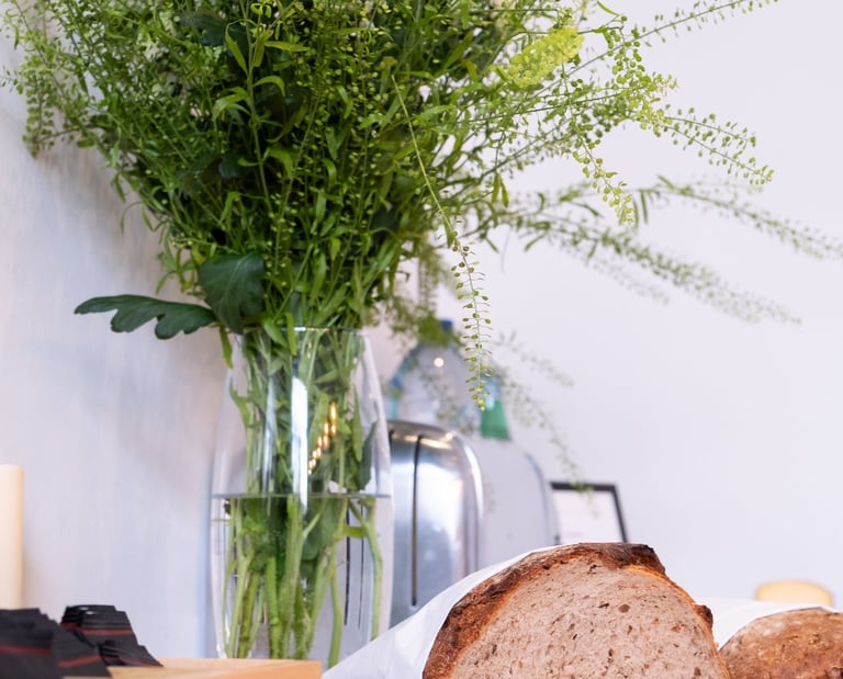 Fresh artisan bread and continental breakfast selection at The Hamptons Boutique Hotel in Ghent.