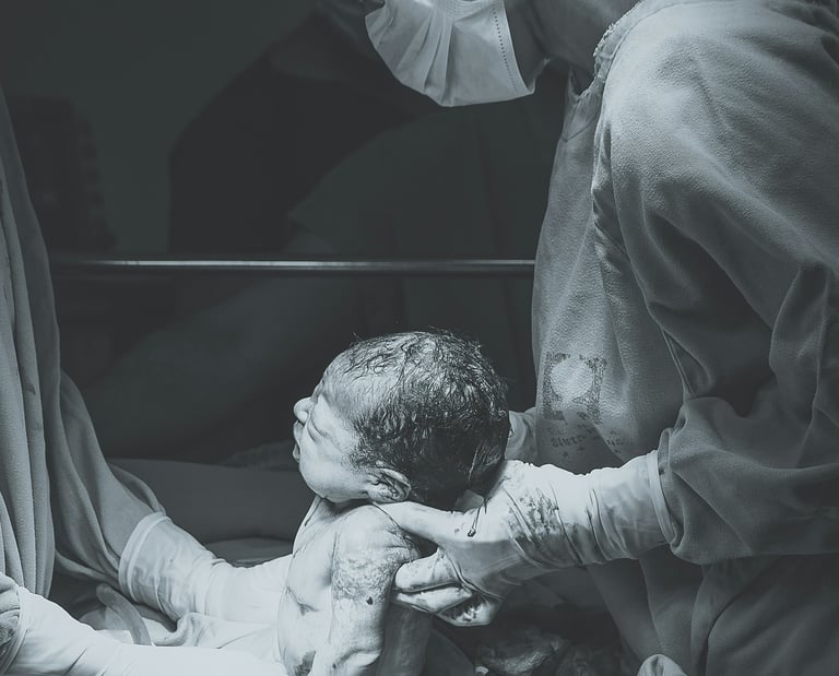 doctor holding newborn baby